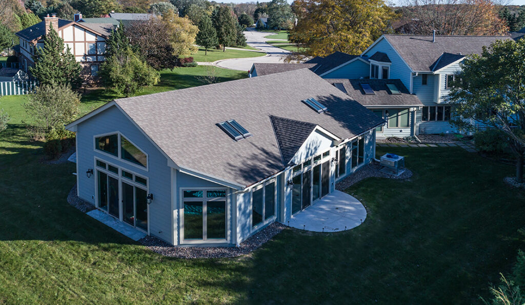 Aerial view of the exterior of a pool room addition built onto a Brookfield home by S.J. Janis.