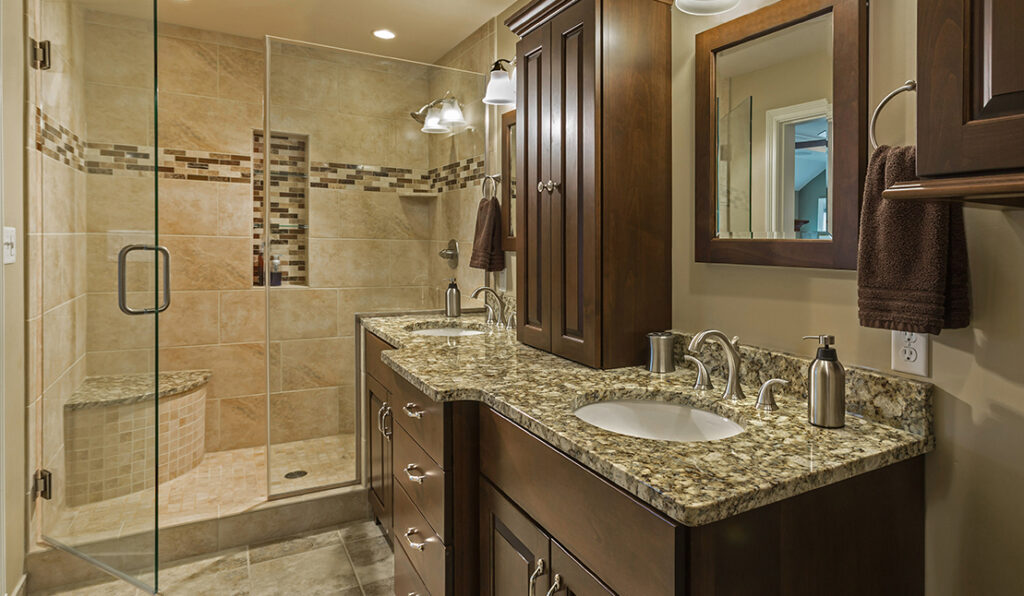 Beautifully renovated bathroom. Features a new glass shower, vanity, flooring, and fixtures.